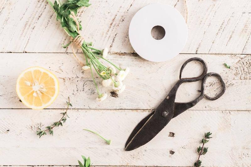 scissors, string, and other craft supplies on a table