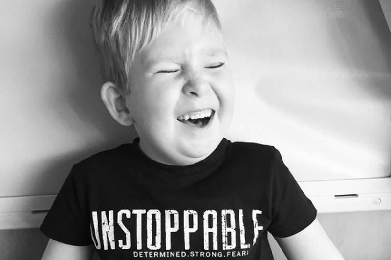 noah in a black and white photo with an unstoppable t-shirt