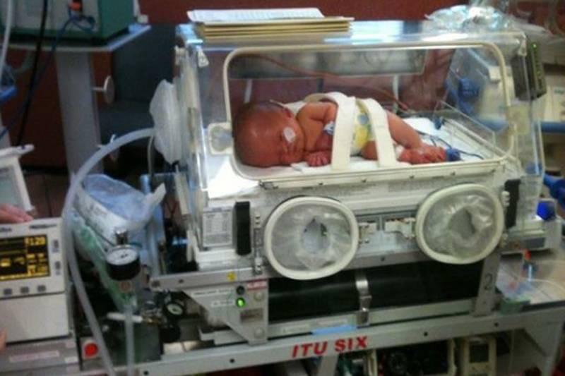 noah in an incubator after being born