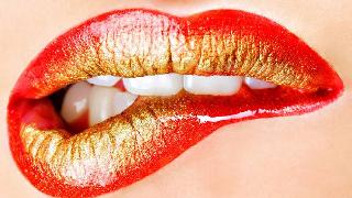 Lip Bite with red and gold lipstick