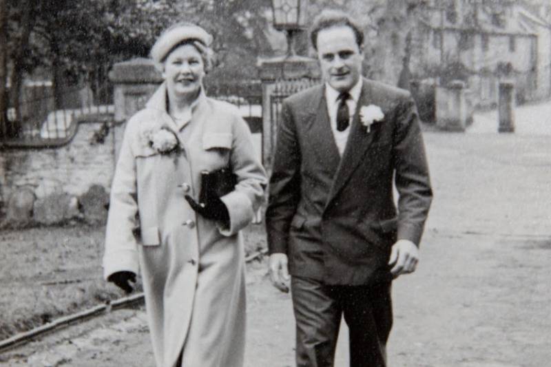 Audrey ad husband walking as a young couple smiling