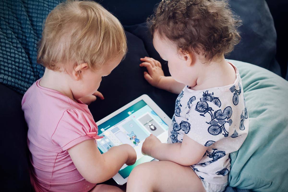 babies looking at an ipad