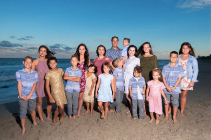 family photo on the beach with all children