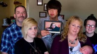 Jenni Lake's family, from left, father Mike Lake, sister Kaisee Lake, boyfriend Nathan Wittman, mother Diana Phillip with Jenni's newborn son Chad Michael Lake Wittman, and sister Ashley Lake pose for a portrait in Pocatello, Idaho on Dec. 6, 2011.
