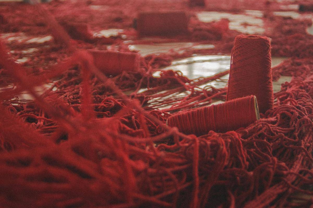 rolls of tangled red thread