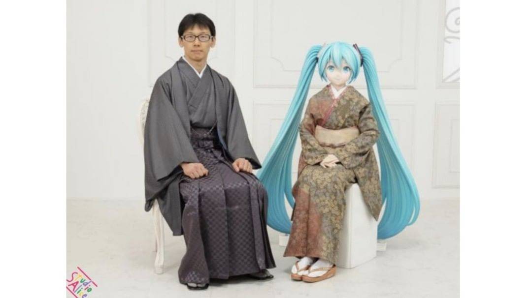 man posing in robe beside anime character 