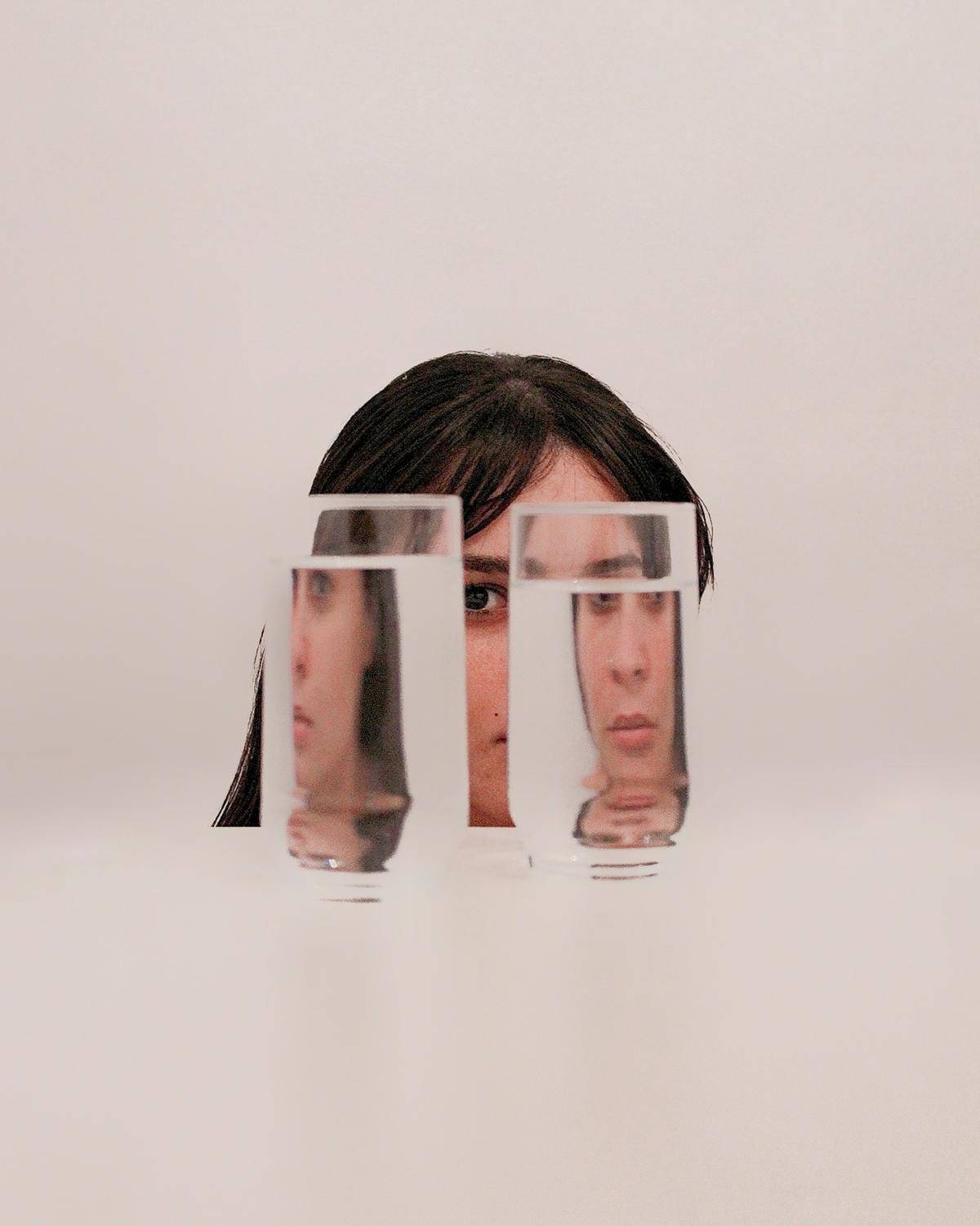 two-women-clear-drinking-glasses-with-water