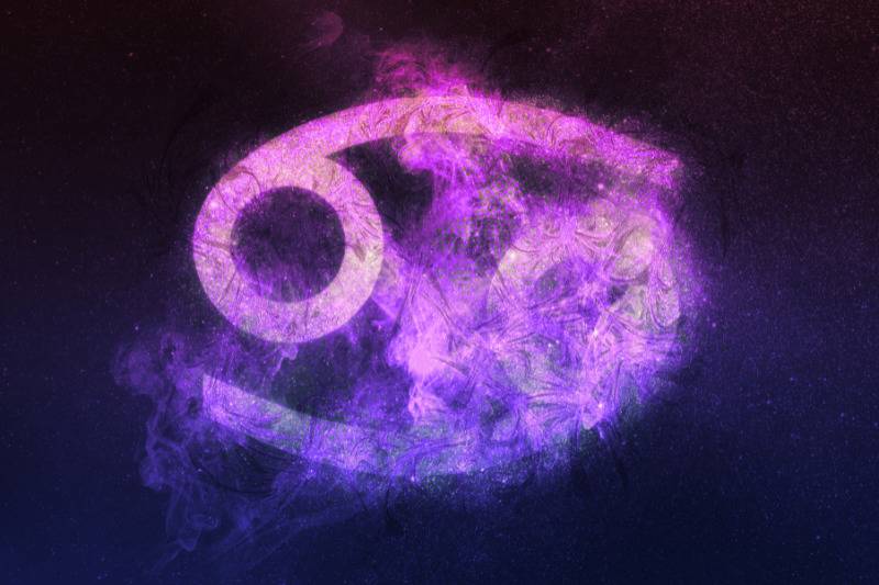 Cancer zodiac sign on purple background