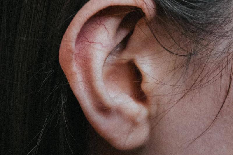 Close up of ear on woman's face with black hair
