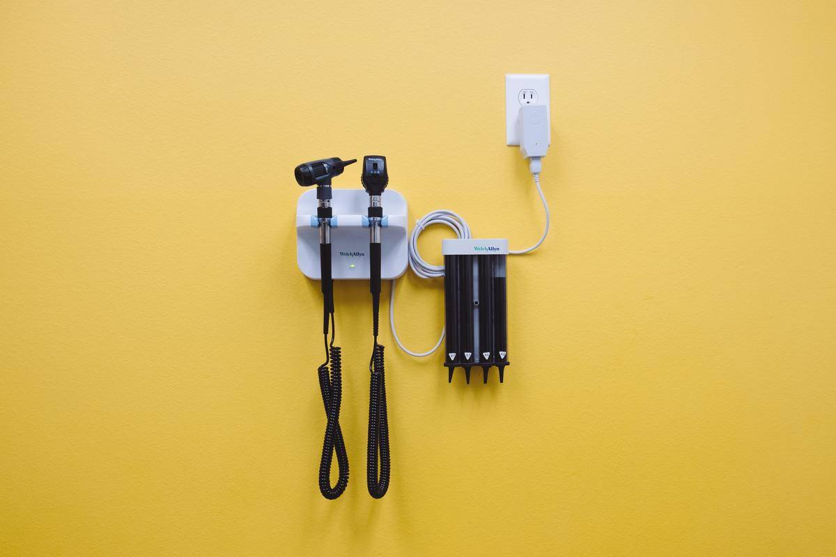 A wall at the Doctor's office with tools hanging on it.