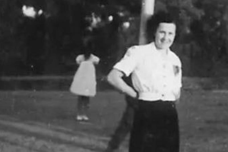Old Photograph A black and white photograph of a lady with a shadow figure in the background.