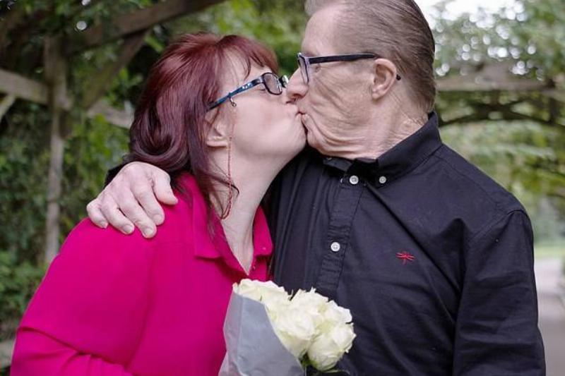 maryanne and her husband share a kiss
