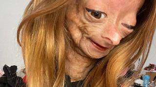 adalia taking selfie with brown wig and eyeliner