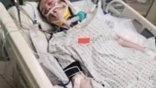 brie laying in hospital bed unconscious