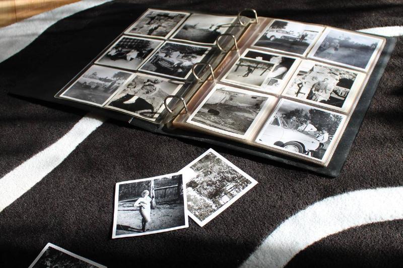 photo album of black and white photos on a carpet