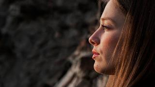 woman's profile looking pensive