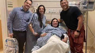 twins and husband at hospital bed