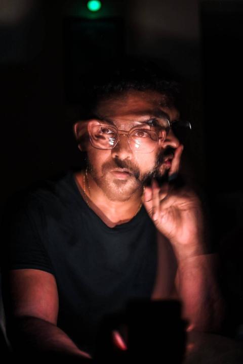 blurry photo of man with glasses