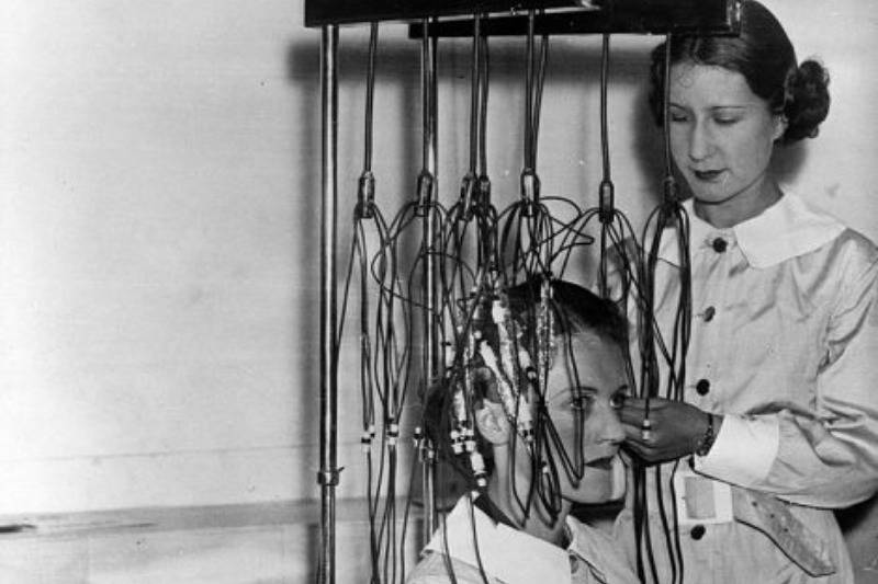 lady getting curls by other lady