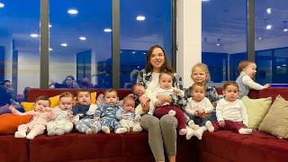 mama sits with all babies on the couch
