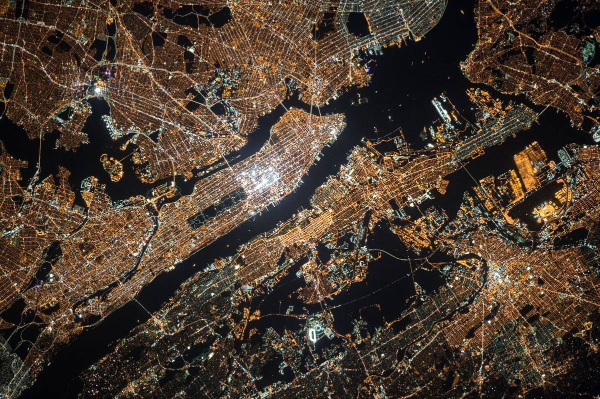 A zoomed-out image of a city, showing a plane-window perspective.