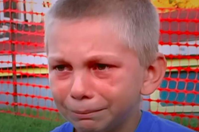 A little boy in tears.