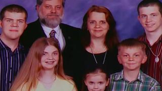 A photograph of a family: a mom, dad, 3 sons and 2 daughters.