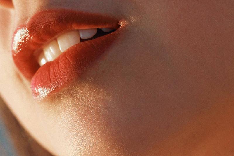 close up of woman's face with red lips