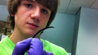 15 year old boy holding his accurate ovarian test