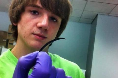 15 year old boy holding his accurate ovarian test