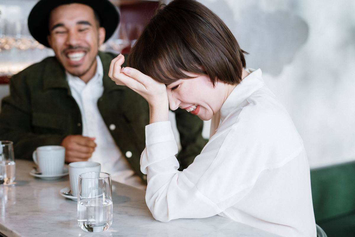 woman-in-white-dress-shirt-holding-clear-drinking-glass