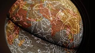 Globe with Stars alignment drawn in white and racing zodiac shapes