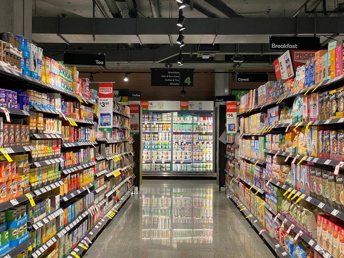 Grocery store aisle with lights mostly off
