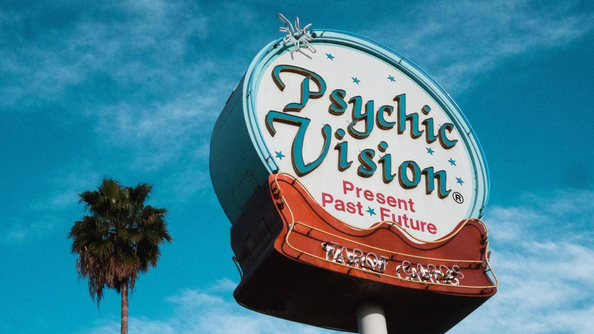 Psychic Vision Sign by palm tree