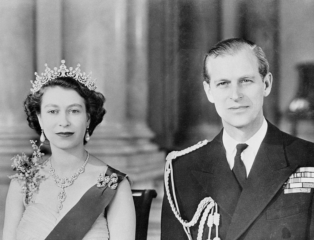  This is a command portrait of Queen Elizabeth II and her husband, the Duke of Edinburgh, as it was made before the Royal pair left on their six month tour of the Commonwealth. the Queen is wearing the Blue Ribbon and Star of the Garter. Her diamond tiara and necklace were wedding presents.