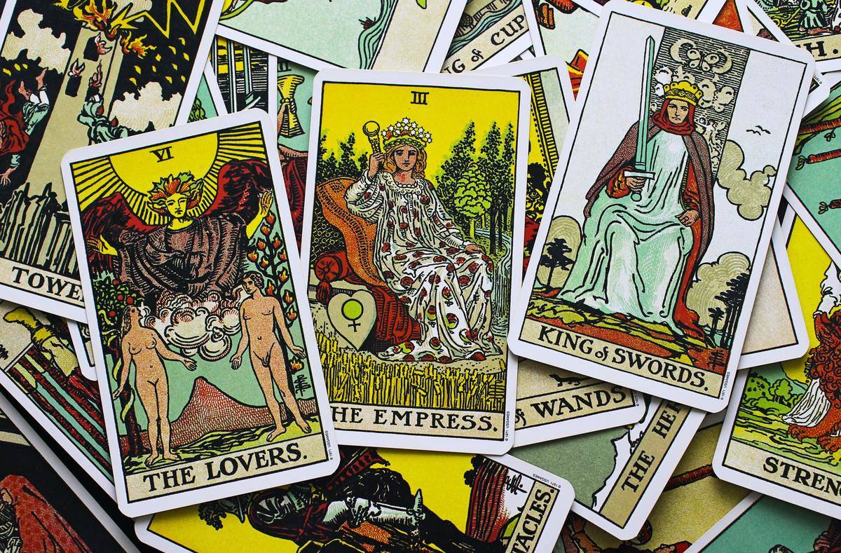 Tarot cards showing the lovers, empress and king of swords