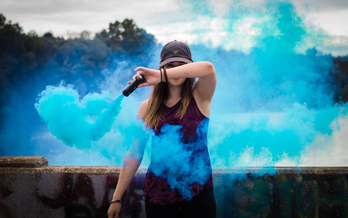 woman-holding-blue-smoke-flare