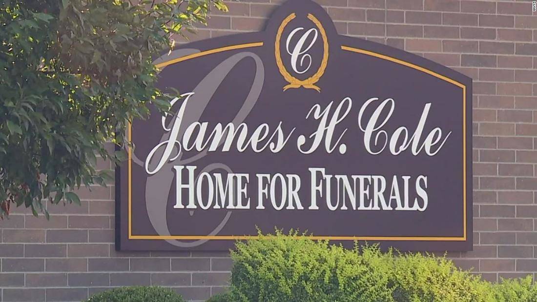 sign for James H Hole Home For Funerals on wall