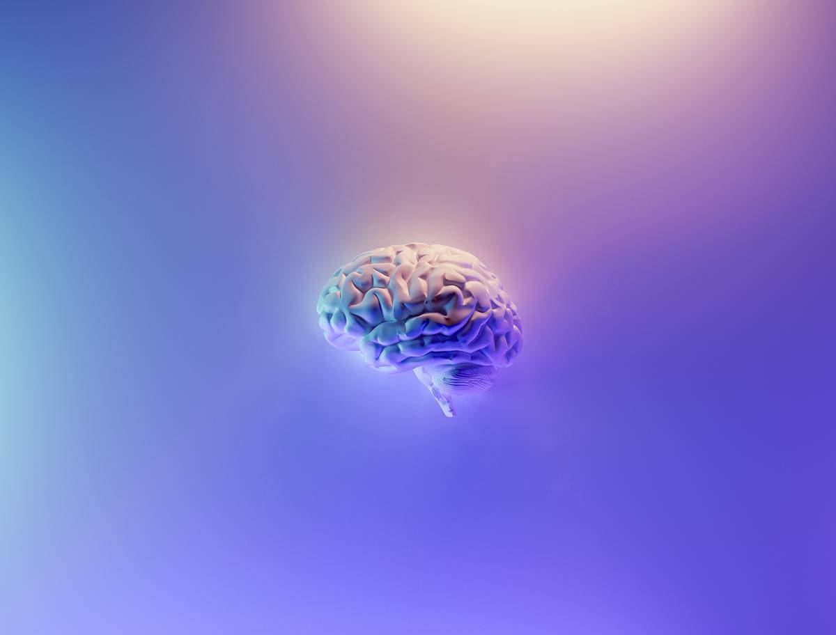 floating brain on purple background