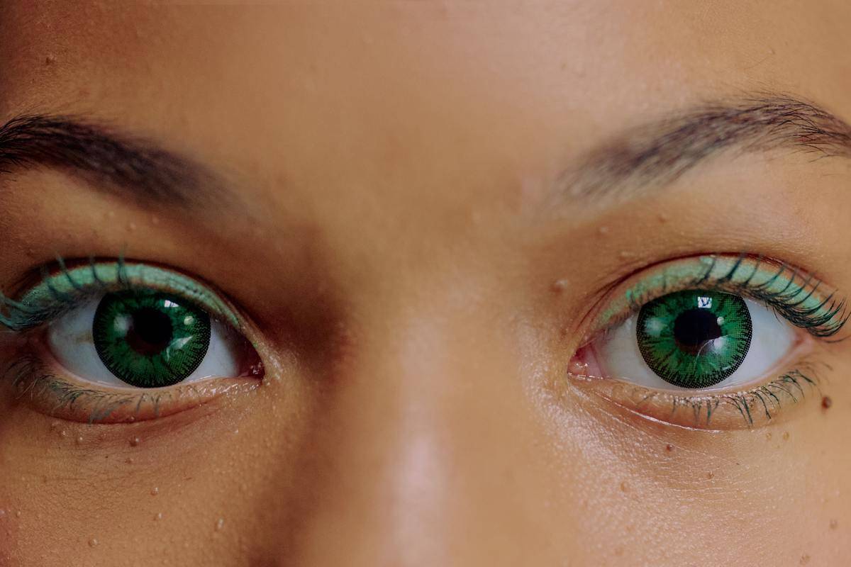 close-up-of-woman-with-green-contact-lenses and green eyeshadow