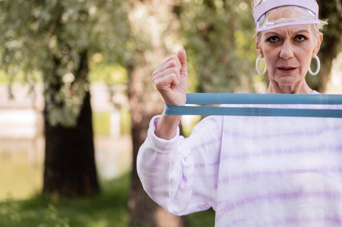 an-elderly-woman-exercising-with-a-resistance-band-