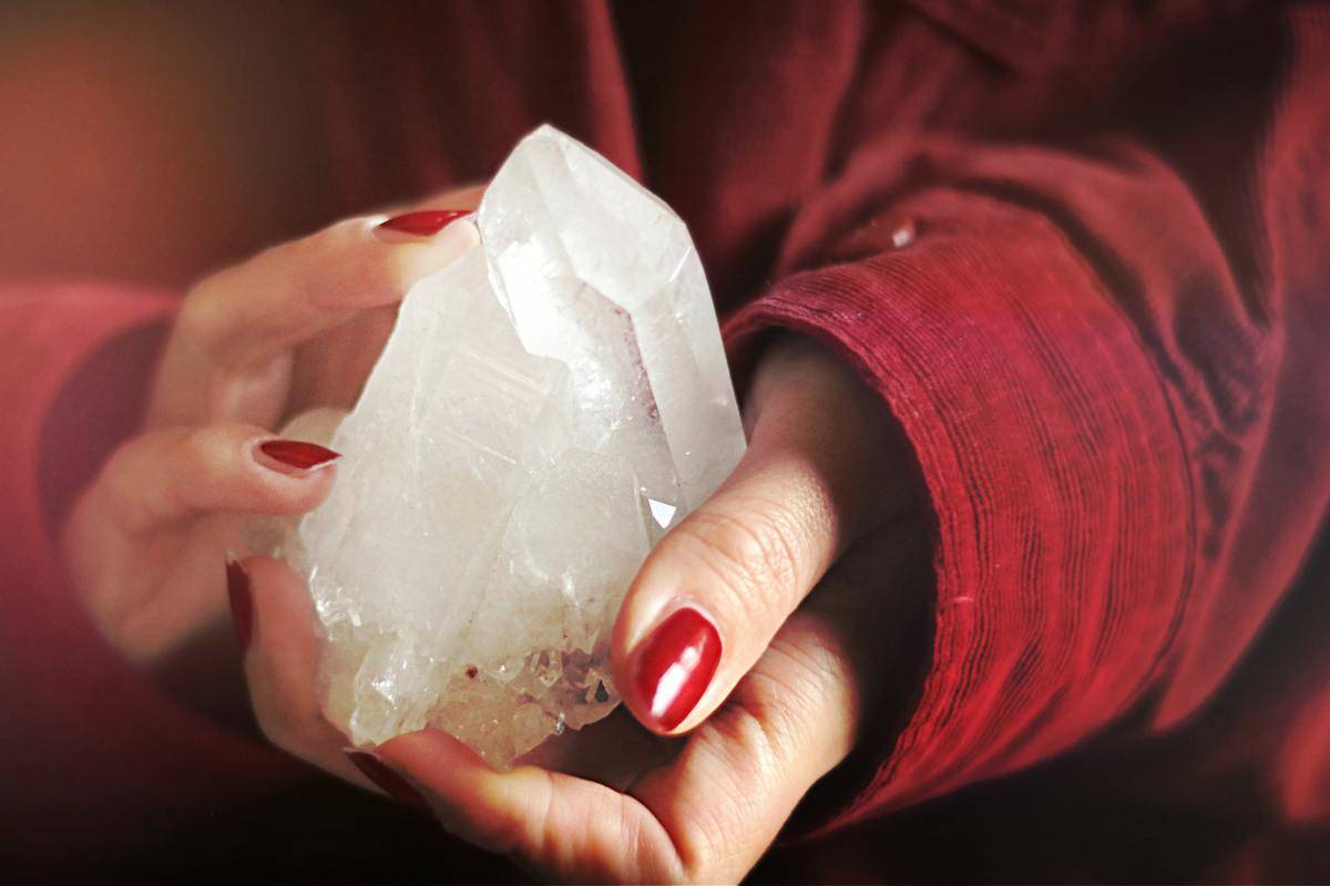 close-up-photo-of-person-holding-crystal-stone