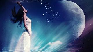 Woman standing on water under moonlight