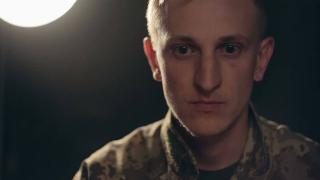 army officer look unfocused on dark background