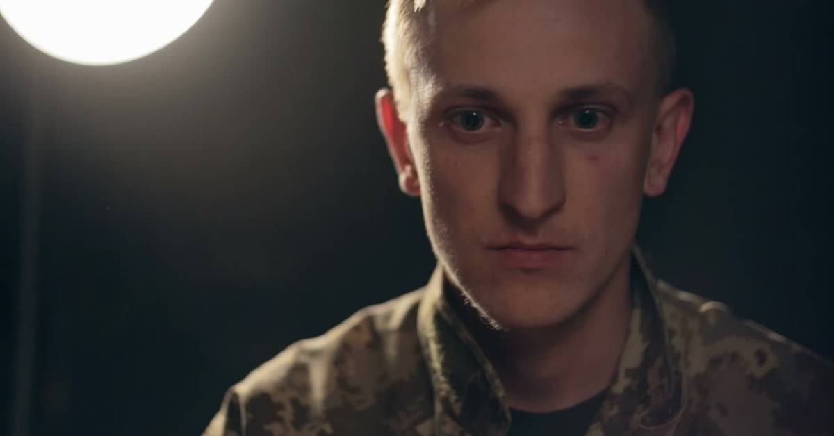 army officer look unfocused on dark background
