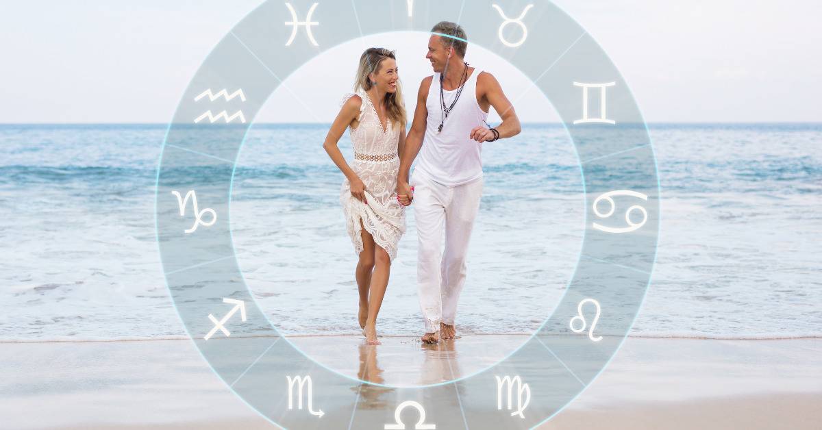 couple on the beach with astrological signs