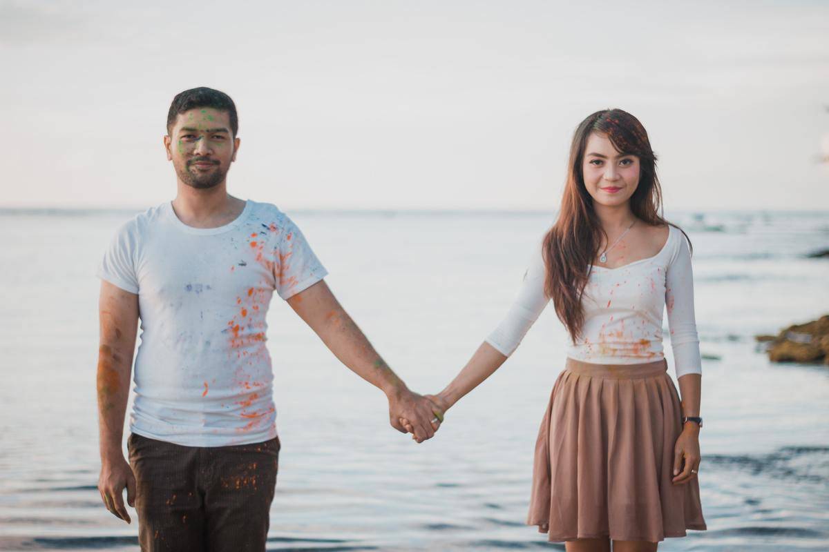 man-and-woman-standing-beside-body-of-water