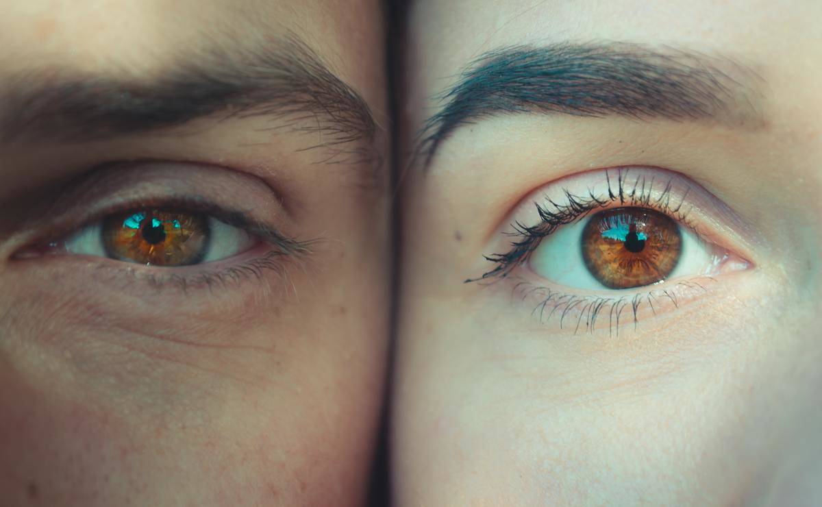 man and woman close up on eyes with their faces touching