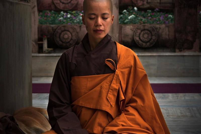 selective-focus-photography-of-monk-during-meditation