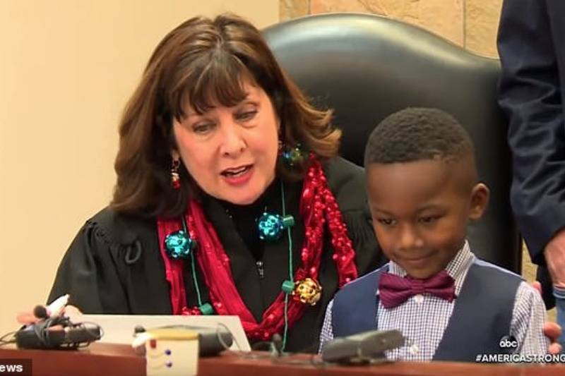 ichael Clark Jr as his adoption proceedings are completed during a hearing in Michigan